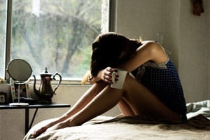 Window bed coffee worry woman pregnancy concern