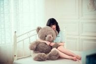 Bed window teddy bear pregnant morning sickness