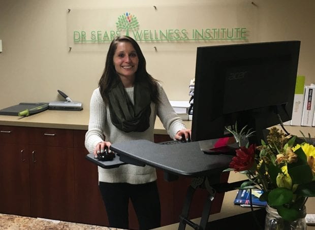 dr sears employee at her standing desk