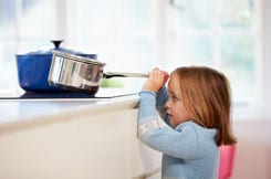 Blonde Girl Near Stove