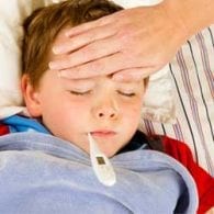 little boy in bed with flu