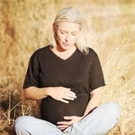 woman in field stressed during pregnancy