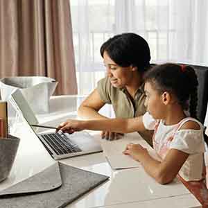 mom helping daughter with distance learning
